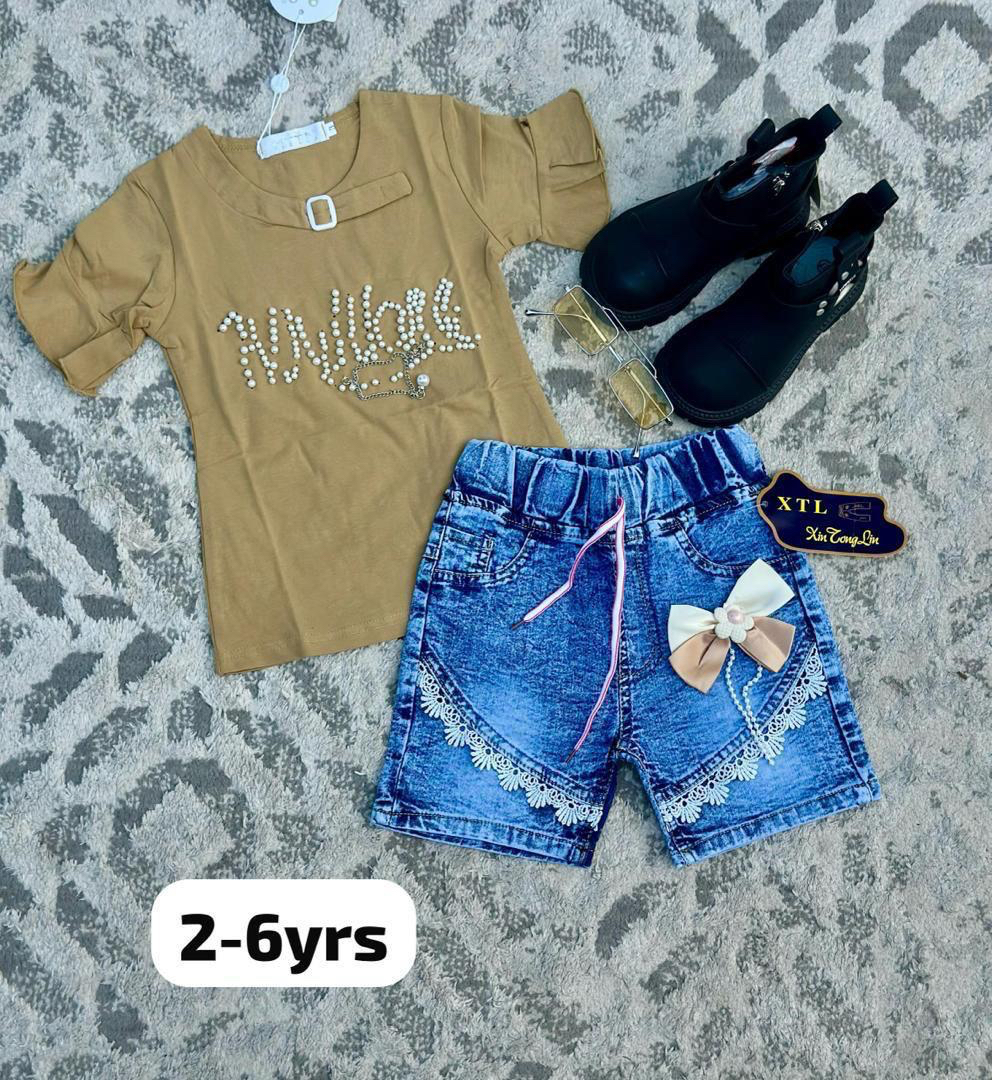 children's outfit featuring a white t-shirt, blue high-waisted denim shorts, black boots, and sunglasses.